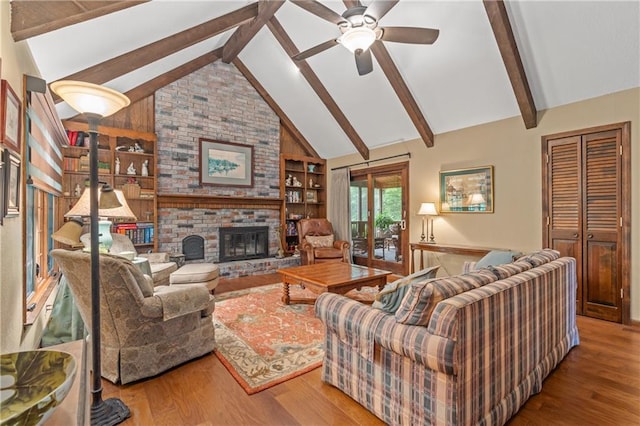 20129 W 112th Cir, Olathe, KS 66061 - living area with ceiling fan, wood finished floors, built in features, and a fireplace