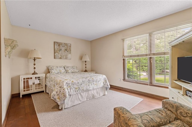 20129 W 112th Cir, Olathe, KS 66061 - bedroom with wood finished floors, baseboards, and a textured ceiling