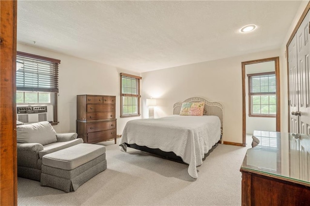 20129 W 112th Cir, Olathe, KS 66061 - bedroom with carpet flooring, multiple windows, cooling unit, and recessed lighting