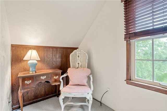 20129 W 112th Cir, Olathe, KS 66061 - sitting room featuring carpet flooring, vaulted ceiling, and wooden walls