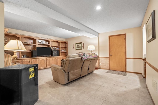 20129 W 112th Cir, Olathe, KS 66061 - living area with a textured ceiling, light tile patterned floors, and recessed lighting
