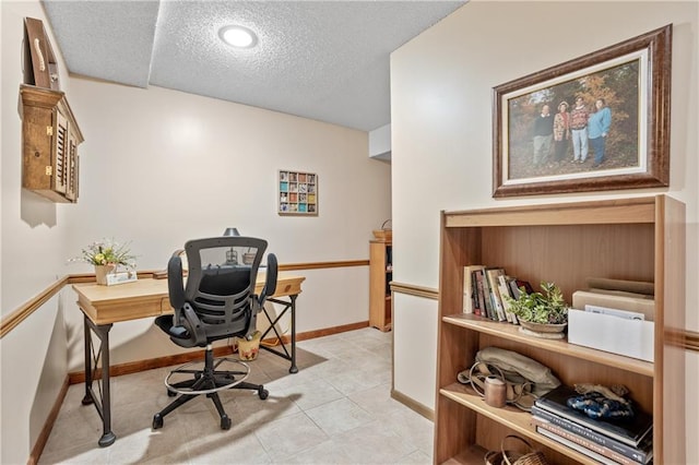 20129 W 112th Cir, Olathe, KS 66061 - home office with a textured ceiling, baseboards, and light tile patterned flooring