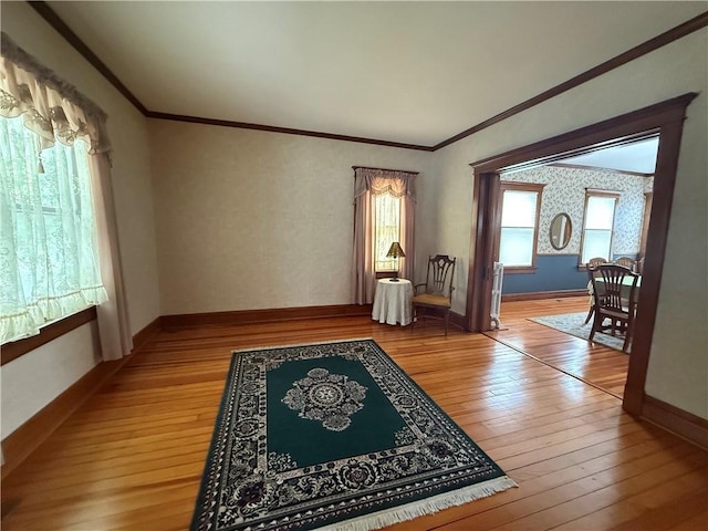 1701 Main St, Lexington, MO 64067 - living room featuring light wood-style flooring and ornamental molding