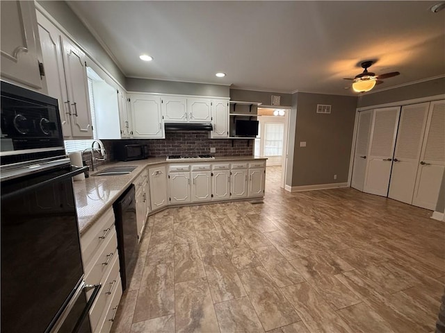 1701 Main St, Lexington, MO 64067 - kitchen with black appliances, ornamental molding, a ceiling fan, backsplash, and white cabinetry