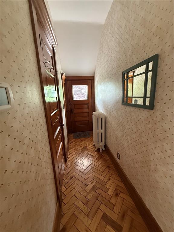 1701 Main St, Lexington, MO 64067 - corridor with radiator heating unit and wallpapered walls