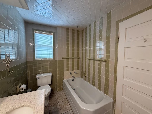 1701 Main St, Lexington, MO 64067 - full bath featuring tile walls, a tub, tile patterned flooring, and vanity
