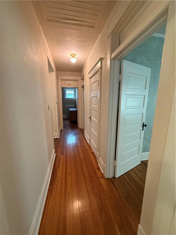 1701 Main St, Lexington, MO 64067 - hallway with hardwood / wood-style flooring and radiator