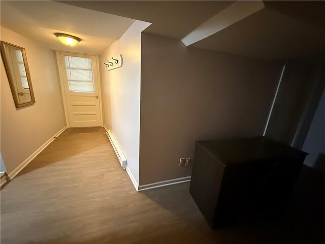 1701 Main St, Lexington, MO 64067 - corridor featuring a baseboard heating unit and wood finished floors
