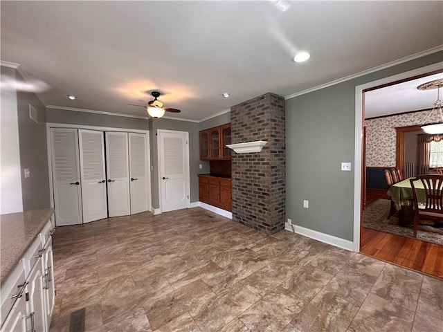 1701 Main St, Lexington, MO 64067 - unfurnished living room with a ceiling fan and crown molding