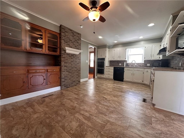 1701 Main St, Lexington, MO 64067 - kitchen with black appliances, crown molding, ceiling fan, decorative backsplash, and under cabinet range hood