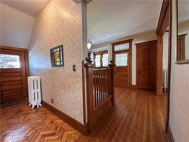 1701 Main St, Lexington, MO 64067 - foyer featuring radiator heating unit, wallpapered walls, and wood finished floors