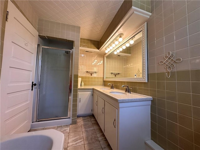 1701 Main St, Lexington, MO 64067 - bathroom with a stall shower, double vanity, tile walls, tile patterned flooring, and backsplash