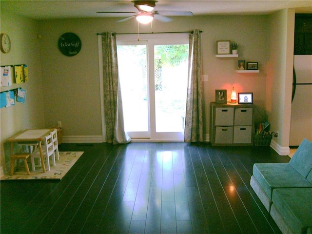 509 Pearl St, Pittsburg, KS 66762 - sitting room featuring a ceiling fan, baseboards, and wood finished floors