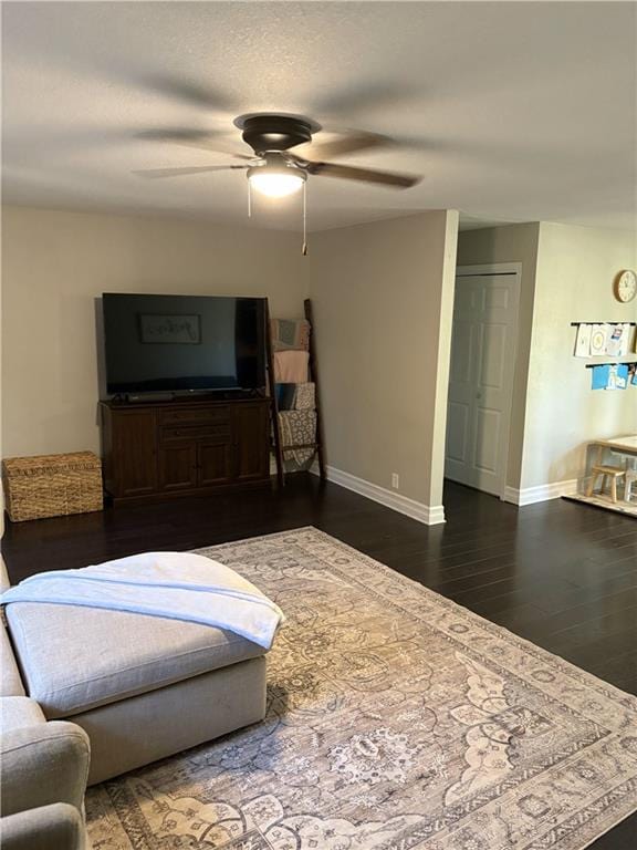 509 Pearl St, Pittsburg, KS 66762 - living room with ceiling fan, baseboards, and wood finished floors