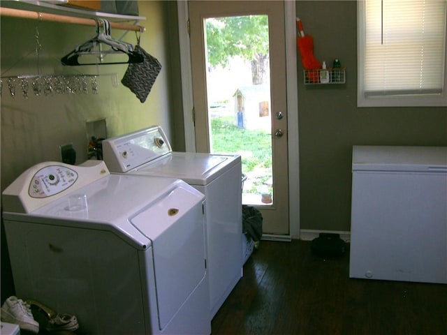509 Pearl St, Pittsburg, KS 66762 - clothes washing area with washing machine and dryer, dark wood finished floors, and baseboards