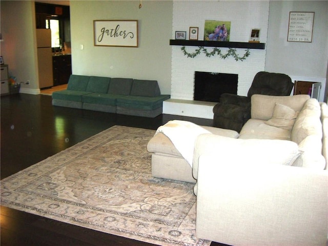 509 Pearl St, Pittsburg, KS 66762 - living area with a fireplace and wood finished floors