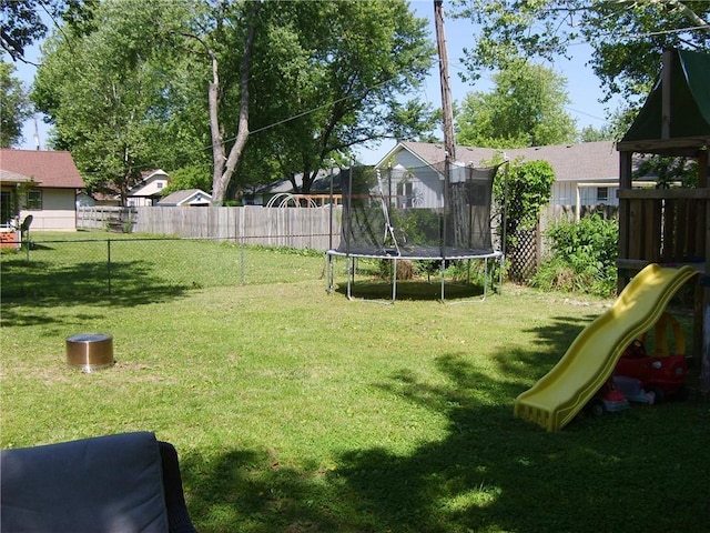509 Pearl St, Pittsburg, KS 66762 - view of yard featuring a trampoline and a playground