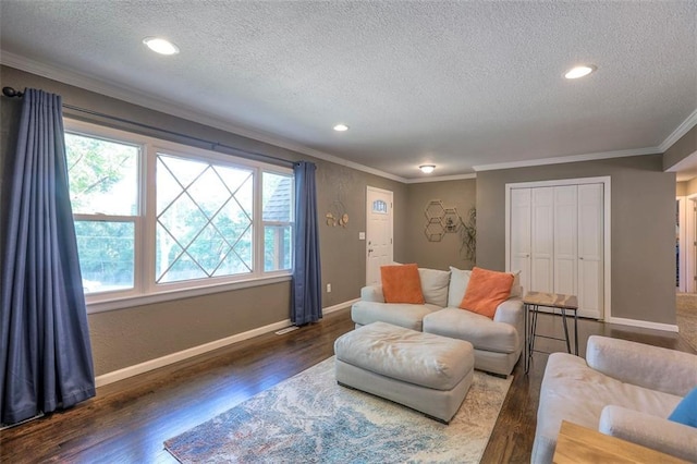 living area featuring crown molding, a textured ceiling, dark wood-style floors, baseboards, and recessed lighting