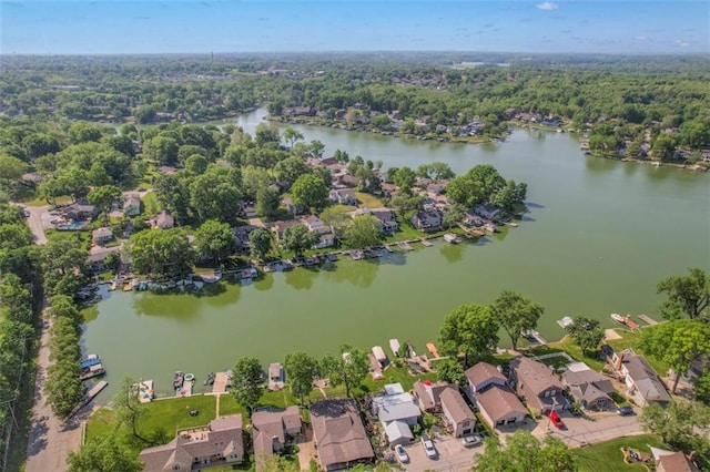aerial perspective of suburban area with a nearby body of water