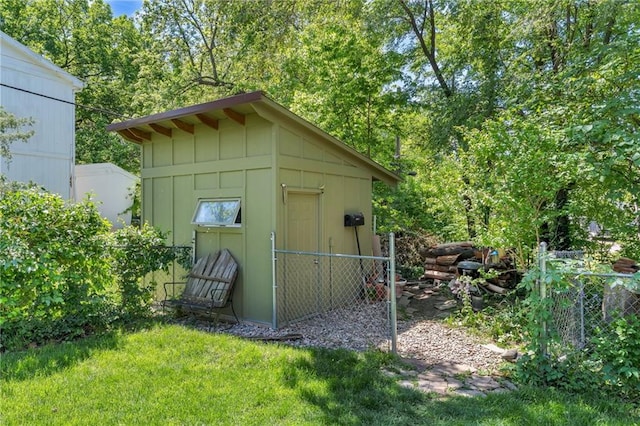 view of shed with fence