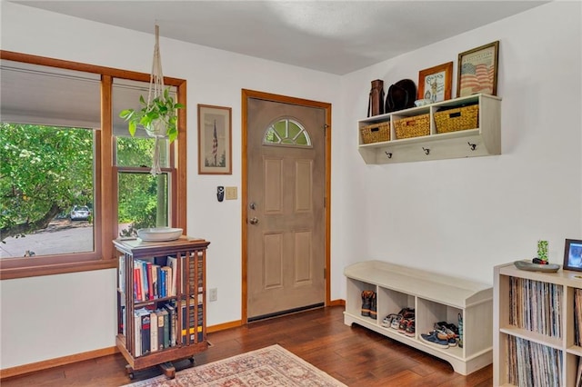 mudroom with wood finished floors and baseboards