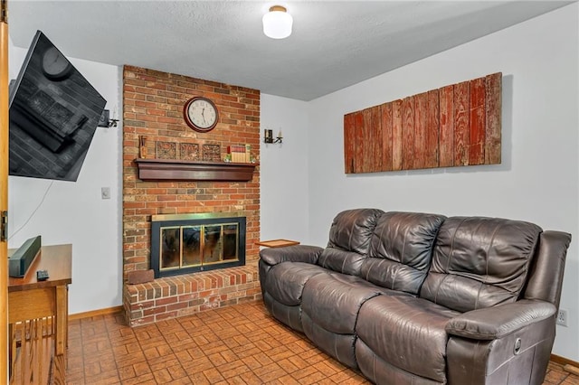 living room featuring brick patterned flooring, a brick fireplace, and baseboards