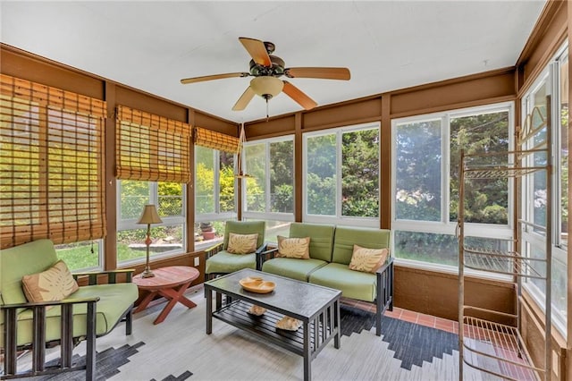 sunroom / solarium with ceiling fan, outdoor lounge area, and plenty of natural light