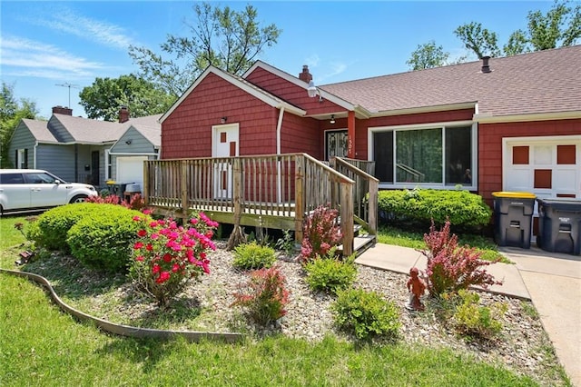 ranch-style house featuring a deck, a chimney, and roof with shingles
