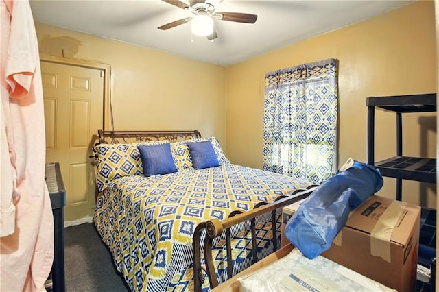 carpeted bedroom featuring ceiling fan
