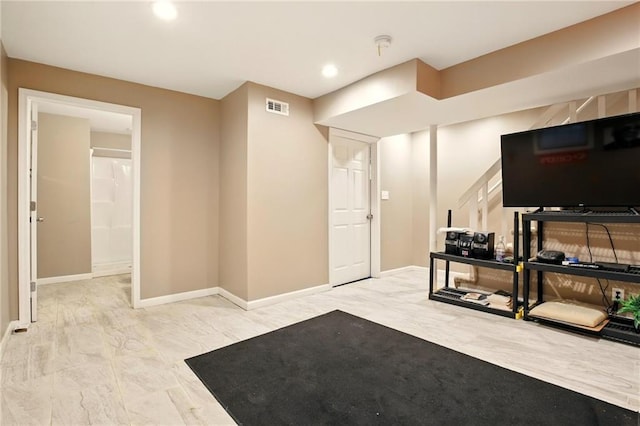 living area with baseboards, marble finish flooring, and recessed lighting