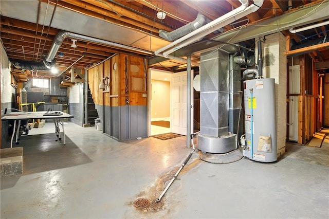 below grade area featuring water heater, stairway, and heating unit