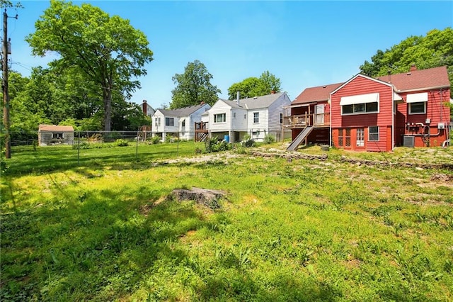 view of yard with fence and a residential view