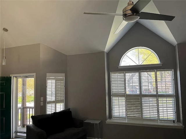 living area with vaulted ceiling and ceiling fan