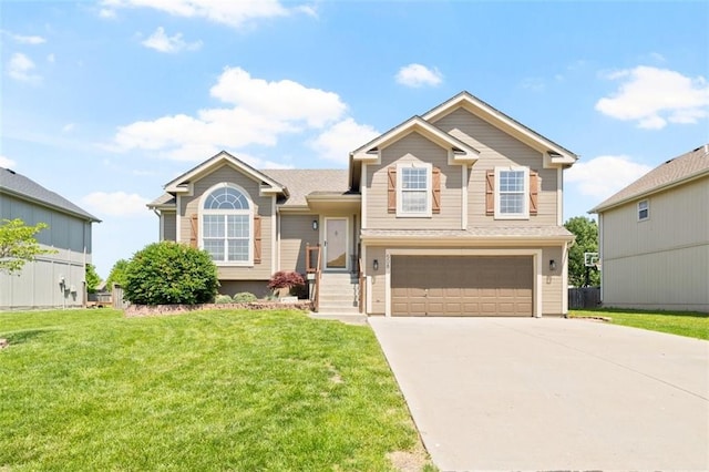 split level home featuring an attached garage, driveway, and a front lawn