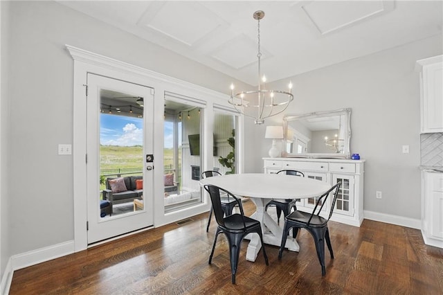 8833 N Crescent Ave, Kansas City, MO 64157 - dining room featuring a chandelier, dark wood-type flooring, french doors, and baseboards