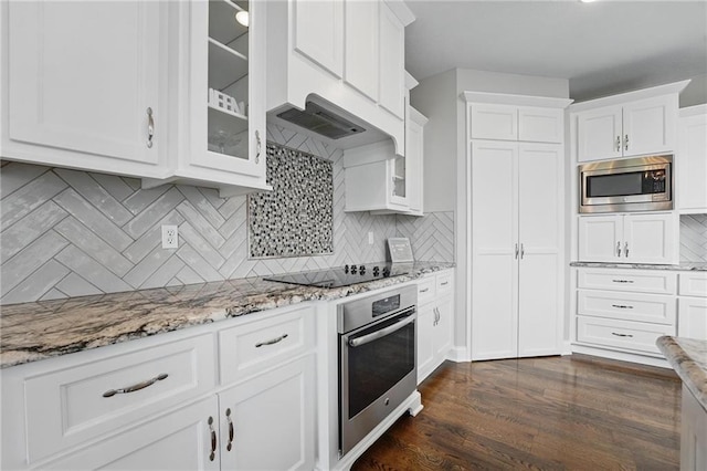 8833 N Crescent Ave, Kansas City, MO 64157 - kitchen featuring appliances with stainless steel finishes, white cabinets, glass insert cabinets, and light stone countertops