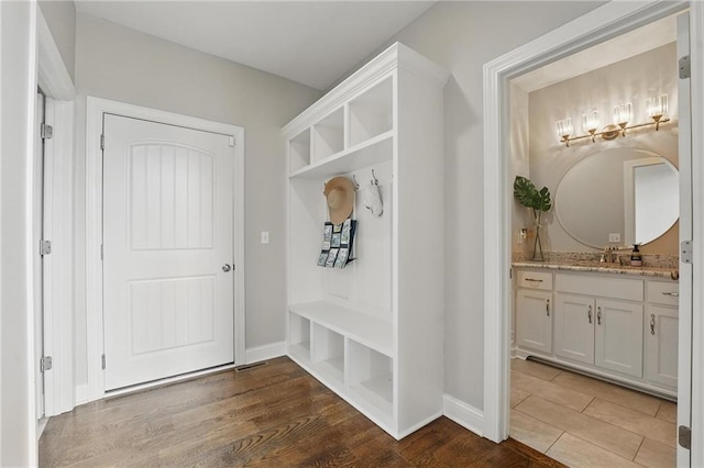 8833 N Crescent Ave, Kansas City, MO 64157 - mudroom featuring wood finished floors and baseboards