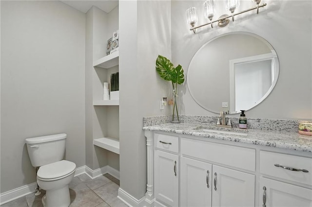 8833 N Crescent Ave, Kansas City, MO 64157 - bathroom with toilet, vanity, a chandelier, baseboards, and tile patterned flooring