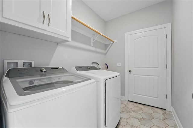 8833 N Crescent Ave, Kansas City, MO 64157 - laundry room with cabinet space, washing machine and clothes dryer, baseboards, and light tile patterned floors
