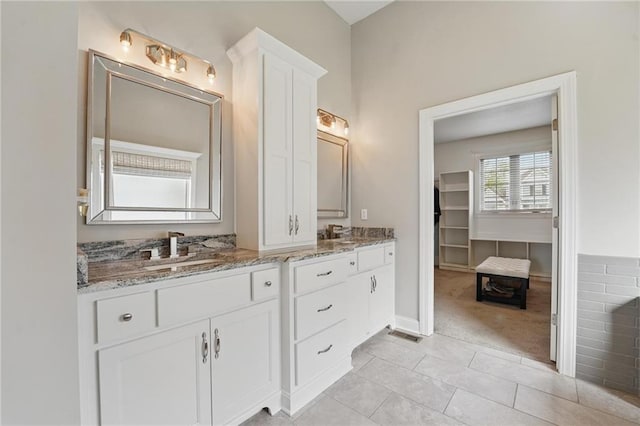 8833 N Crescent Ave, Kansas City, MO 64157 - full bath featuring double vanity and tile patterned floors