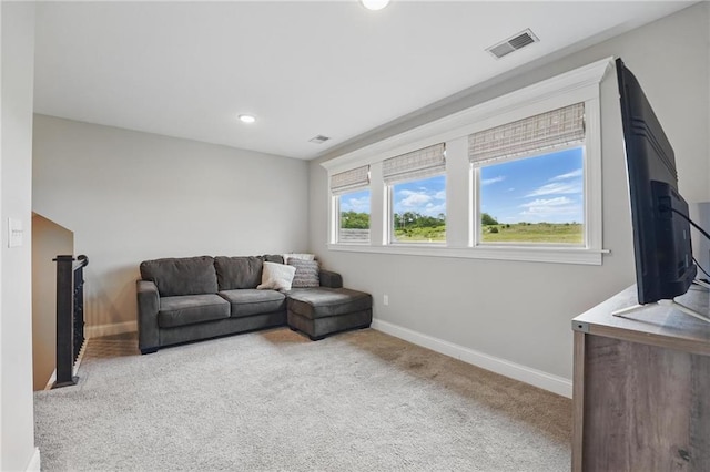 8833 N Crescent Ave, Kansas City, MO 64157 - carpeted living room featuring baseboards and recessed lighting
