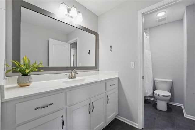 8833 N Crescent Ave, Kansas City, MO 64157 - full bath featuring vanity, baseboards, toilet, and tile patterned floors