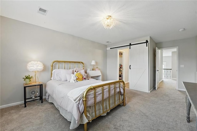 8833 N Crescent Ave, Kansas City, MO 64157 - bedroom featuring carpet floors, a barn door, a spacious closet, and baseboards