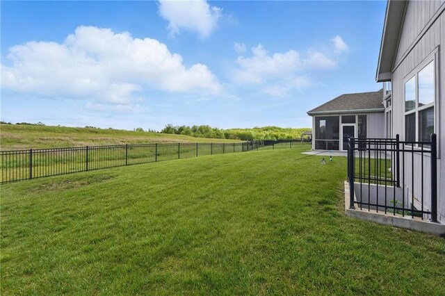 8833 N Crescent Ave, Kansas City, MO 64157 - view of yard featuring a sunroom and a rural view