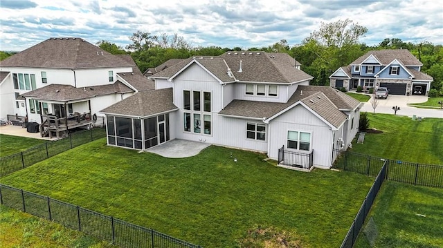 8833 N Crescent Ave, Kansas City, MO 64157 - rear view of property with a sunroom, a shingled roof, and a residential view