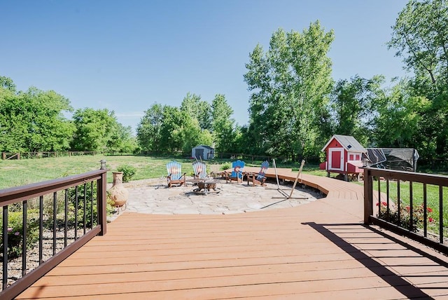 2251 Valley View Dr, Tonganoxie, KS 66086 - wooden deck with an outdoor fire pit and view of scattered trees