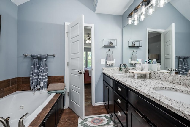 2251 Valley View Dr, Tonganoxie, KS 66086 - bathroom with double vanity, ensuite bath, and a whirlpool tub