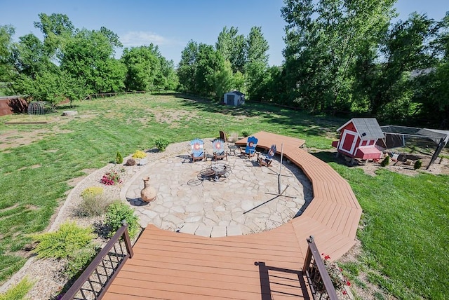 2251 Valley View Dr, Tonganoxie, KS 66086 - view of yard with a patio, view of wooded area, and a deck