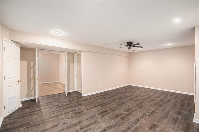 spare room featuring dark wood-type flooring, baseboards, recessed lighting, and ceiling fan
