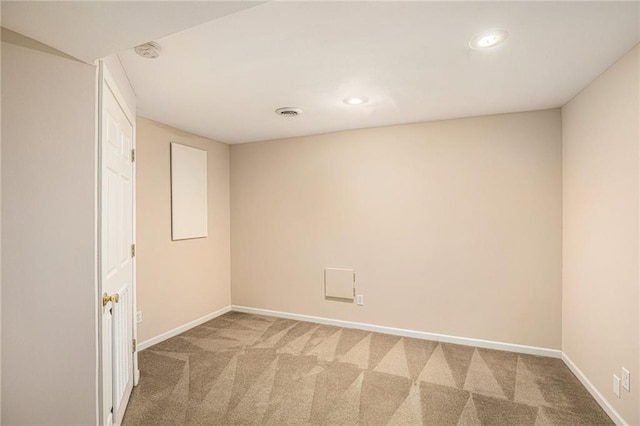 spare room with carpet, baseboards, recessed lighting, and a smoke detector
